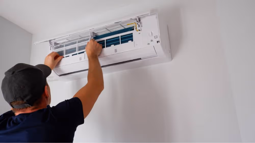 man installing a mini split ac